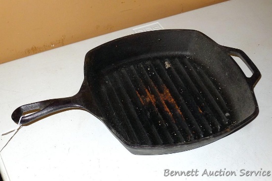 Lodge cast iron grill pan is in good condition. It's a little sticky, but will clean up great.