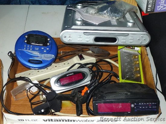 Undercabinet radio/CD player, alarm clocks, CD Walkman style player with headphones, power strip.