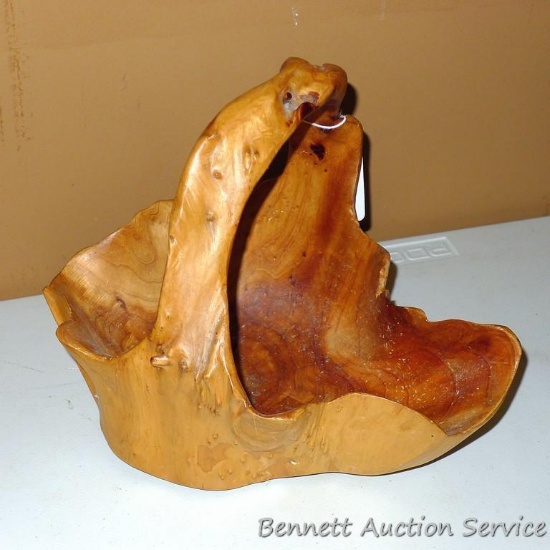 Unique wooden bowl is in good condition. We thing this was made out of one piece of wood, neat