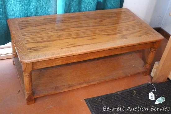 Nice oak coffee table is approx 44"x 22"x 16". Some chips noted on bottom shelf, overall nice piece.