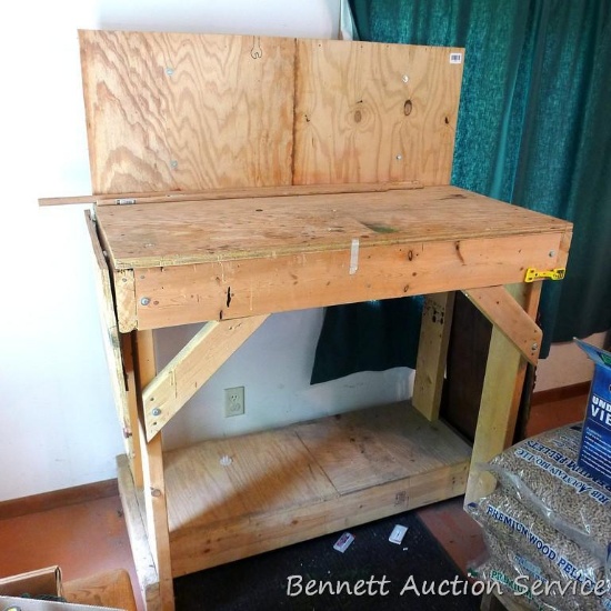 Large homemade workbench is approx 48"x 24"x 43". Comes with dropleaf, bottom shelf to top shelf is