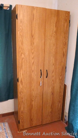 Pressboard wardrobe has been converted to a gun cabinet and measures approx 71`"x 16"x 30". See