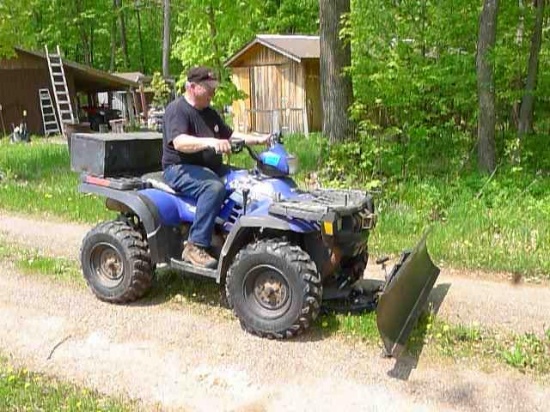 Watch the video!  Polaris 2004 Sportsman's ATV. Has a true 4x4 on demand. Includes a 5 foot snowplow