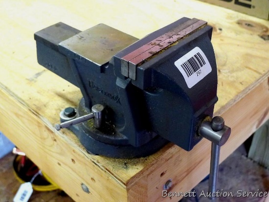 PerformaX swivel bench vise with 5" jaws appears to work good. Bring tools to remove from bench.