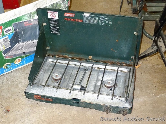Coleman 2 burner propane stove. Needs a good cleaning.