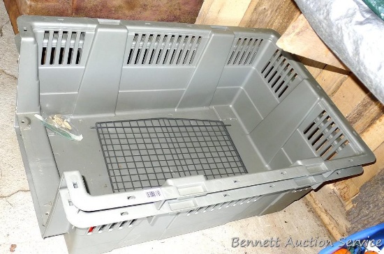 Large plastic pet tote or kennel measures 27" wide x 40" long x 32" high. In good used condition.