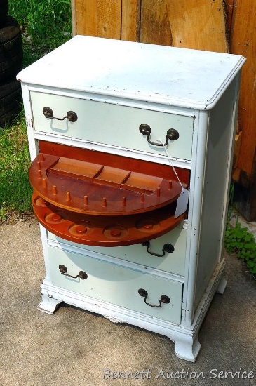 Cute little sewing cabinet. Three regular drawers and one swivel drawer for storing spools and