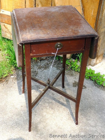 Cute little drop leaf end table is sturdy and in good shape. Measures 28" high x 16" x 16" with