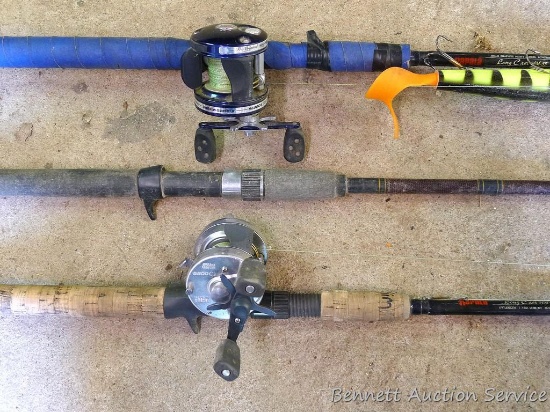 Three fishing rods, 2 have reels. One Daiwa graphite rod 60" tall. One is Rapala graphite rod 78"