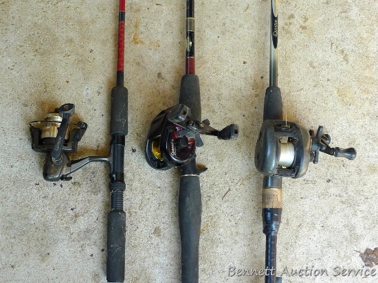Three fishing rods with reels. One Fenwick rod 78" tall with a Quantam reel, one Quantam rod 74"