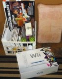 Wii control box, instructions, seven Wii games, Wii board, two dumbbells, more. Also comes with