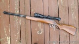J.C. Higgins model 44 DLM lever action .22 Magnum rifle with Tasco 4-16 x 40 scope. Rifle has a 24
