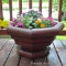 Well made patio or deck planter is over 2' across. Comes with a nice variety of flowers. Bring a