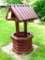 Wishing well garden piece would look great with a basket of flowers in the center. Stands 4-1/2'