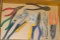 Assortment of pliers includes needle nose, side cutters, adjustable pliers and more.
