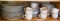 Stoneware dinner ware is in good condition. Includes nine of one style and four different style