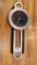 Howard Miller battery operated wall clock is in good condition.