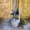 New corn broom, wall mount hose keeper, small and large leaf rakes, hoe, dirt spade, more.