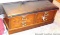 Lane cedar chest is in good condition with a padded top. Measures approx. 42