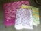 Three handmade afghans are all in good condition. Pink afghan measures 6' x 6'.