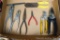 Assorted pliers and a bypass pruner.