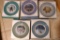 Five Avon Christmas Collector's plates dated 1979, 1978, 1977, 1976, and 1975.
