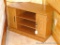 Nice side table or short entertainment stand is made to fit neatly in a corner. Measures nearly 3'
