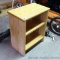 Sturdy little shelving unit with adjustable shelf is approx. 1-1/2' x 2' tall.