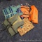 Five life vests or flotation devices. One adult medium, one adult universal, more.