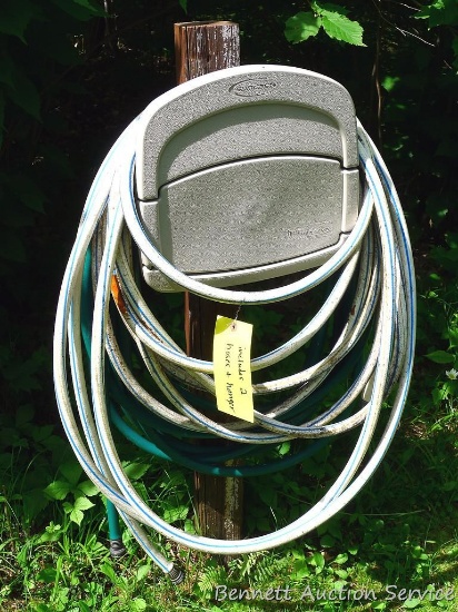 Suncast Hose Hangout wall mount hose keeper plus a length of garden hose. Please bring tools to