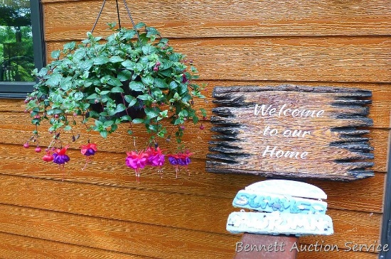 Wooden welcome sign is 22" wide, other welcome sign is 10" wide.
