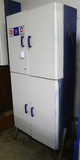 Delco metal 4 door cabinet 29-1/2" x 68" x 13-1/2". Contents not included.