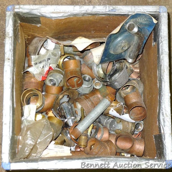 Partial crate full of plumbing fittings, includes nipples, copper and more.