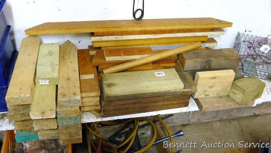 Assortment of wood pieces, includes treated, homemade stakes out of 2x4s 19-1/2" long.