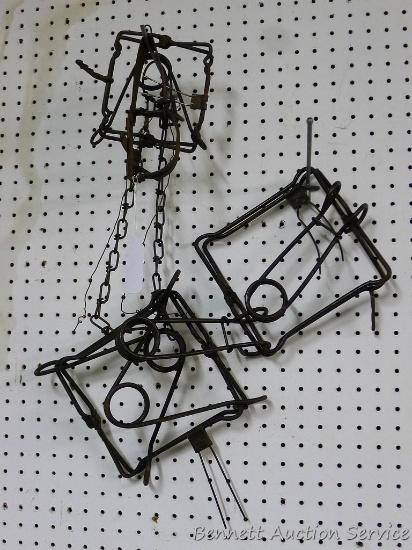 Traps including 8" conibear; 6" conibear; small snap trap. Some parts missing.