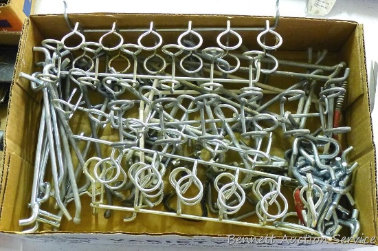Box full of peg board hangers.