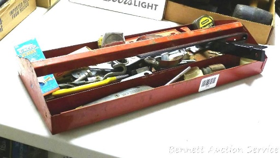 Metal tool box tray filled with tape measures; wrenches and more.