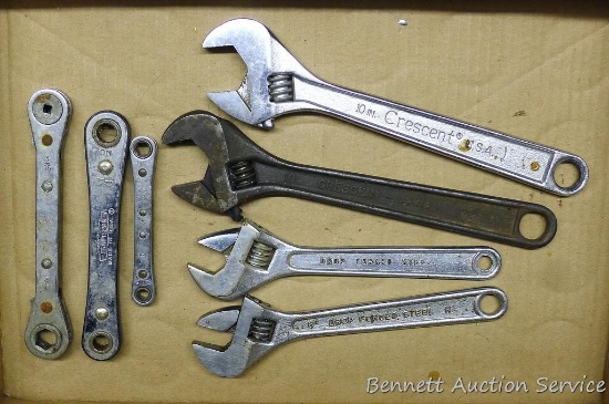 Ten inch crescent wrench; two 8" adjustable wrenches; Craftsman and more ratcheting wrenches.