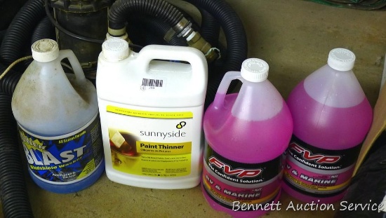 Two gallons of RV & Marine Antifreeze; partial jug of window wash; partial jug of paint thinner.