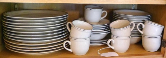 Stoneware dinner ware is in good condition. Includes nine of one style and four different style