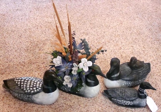 Four decorative ceramic loons. Largest is 10" x 6". One is a planter.