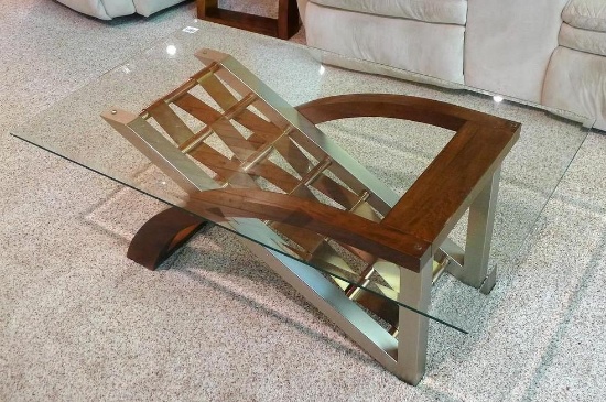 Beautiful glass top coffee table 48" x 28" x 19" tall. Has brushed chrome with bronze and wooden