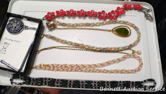 Women's necklaces, one is magnetic.