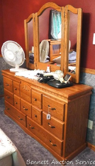 Very nice Wolfcraft 8 drawer dresser made of oak with folding 3 piece mirror. 61" wide x 17" x 34"