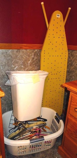 Metal ironing board 56" long; laundry basket; hangers; garbage can.