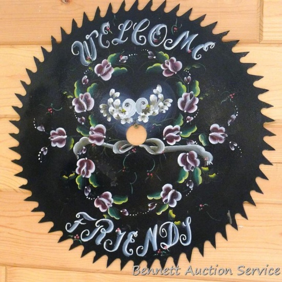 Hand painted saw blade Welcome Friends is 18" across.