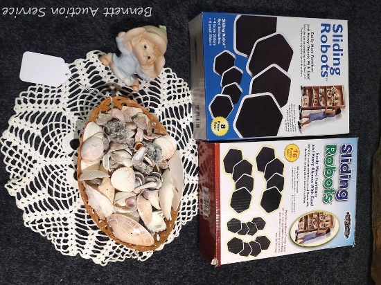 Partial boxes of sliding robots, plus a basket of sea shells and more.