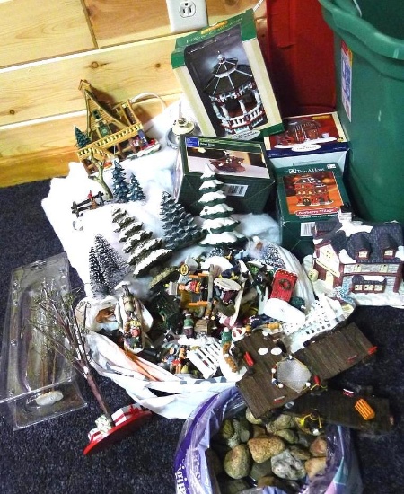 Assorted Christmas village pieces and accessories.