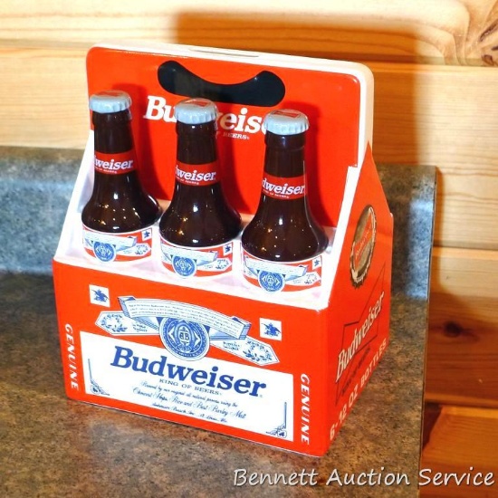 1998 Budweiser ceramic coin bank with some contents. Stands nearly 8" high.