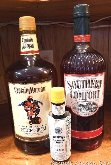 No shipping. 1.75 liter bottles of Captain Morgan and Southern Comfort, plus a bottle of bitters.